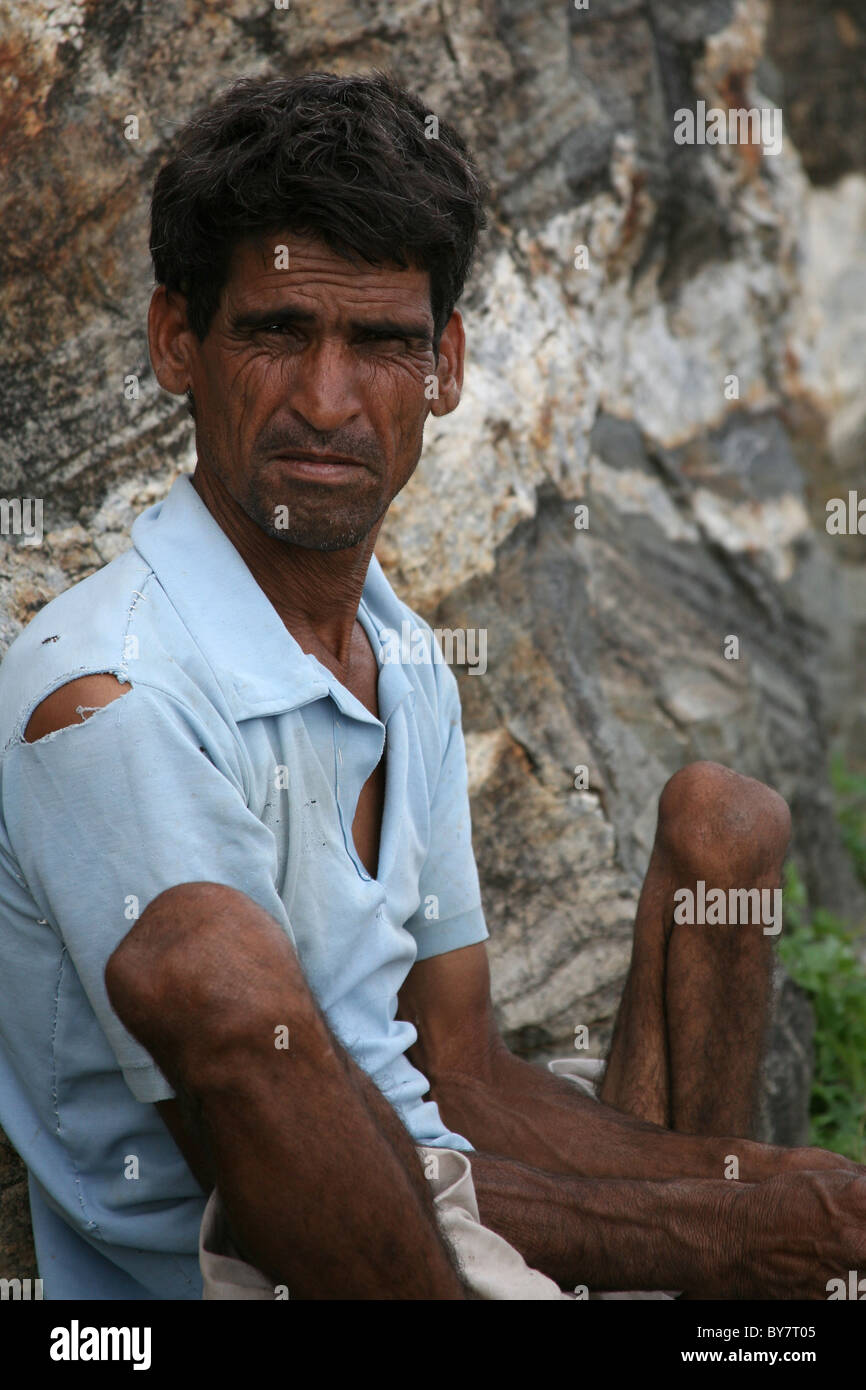 Indian worker resting at Kumbalgarh Fort near Udaipur, Rajasthan, India Stock Photo