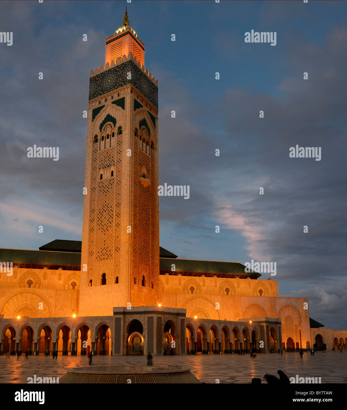 Lights on Hassan II Mosque and minaret in Casablanca Morocco at dusk Stock Photo
