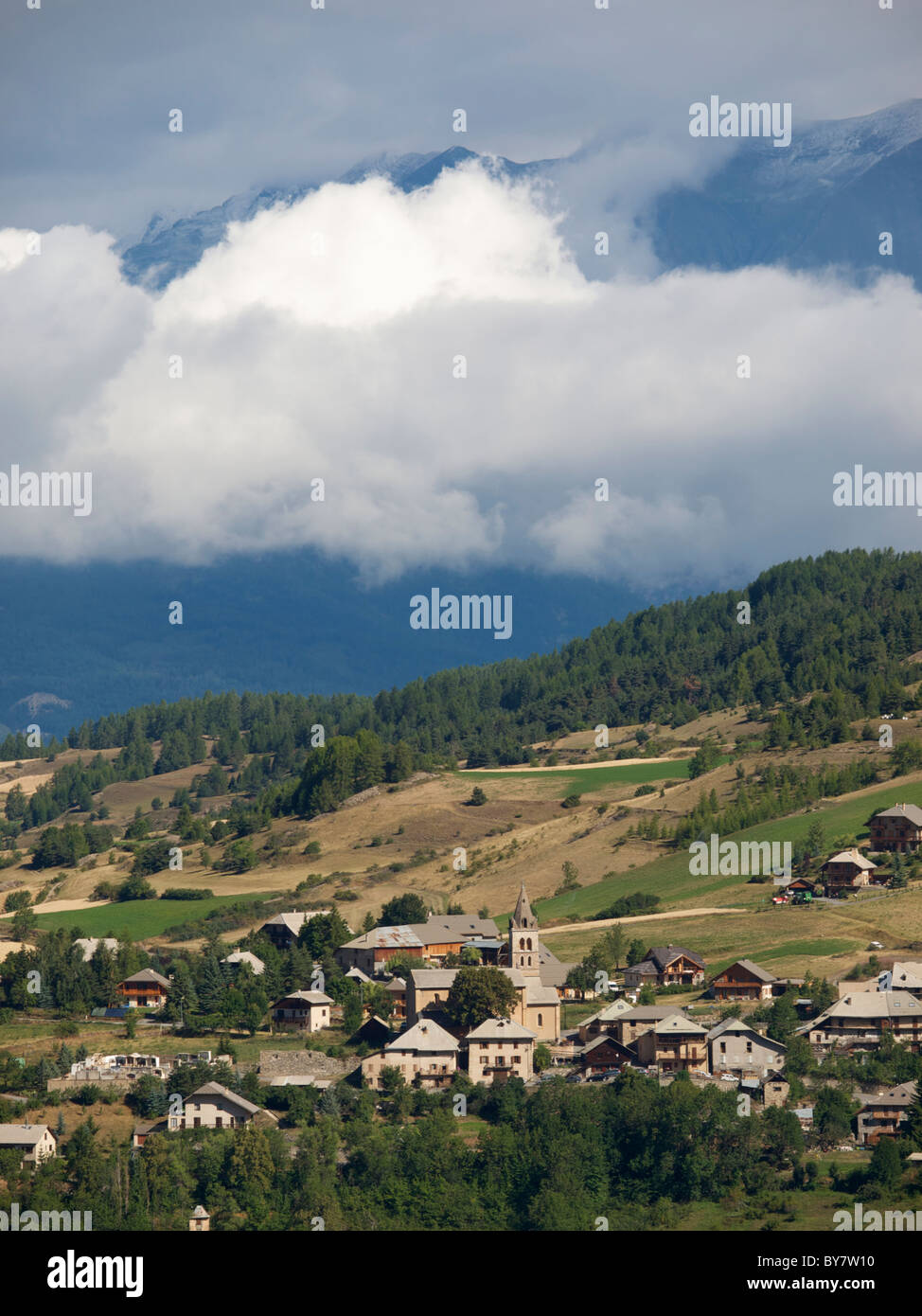 French Alps with village and cloud layer at Les Orres, Hautes Alpes, France Stock Photo