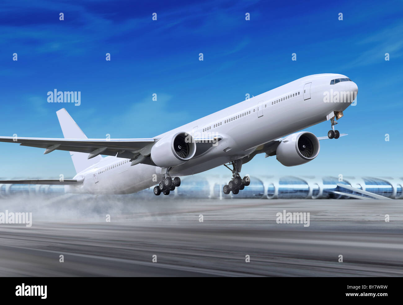 white passenger plane is landing away from airport Stock Photo - Alamy