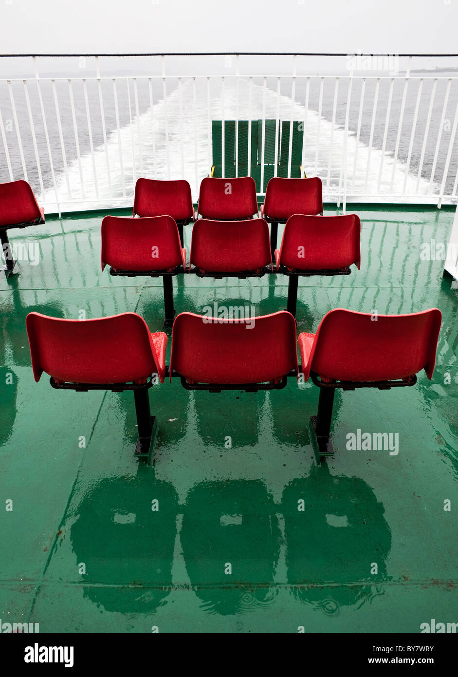 Outer deck seating of the Caledonian MacBrayne ferry from Lochboisdale to Oban on a rainy day, Scotland Western Isles Stock Photo