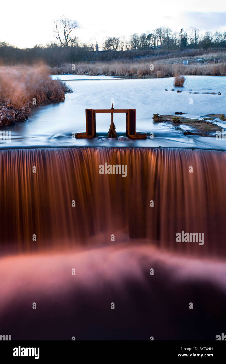 A burn in Burnside of Duntune after a period of heavy rain side lit