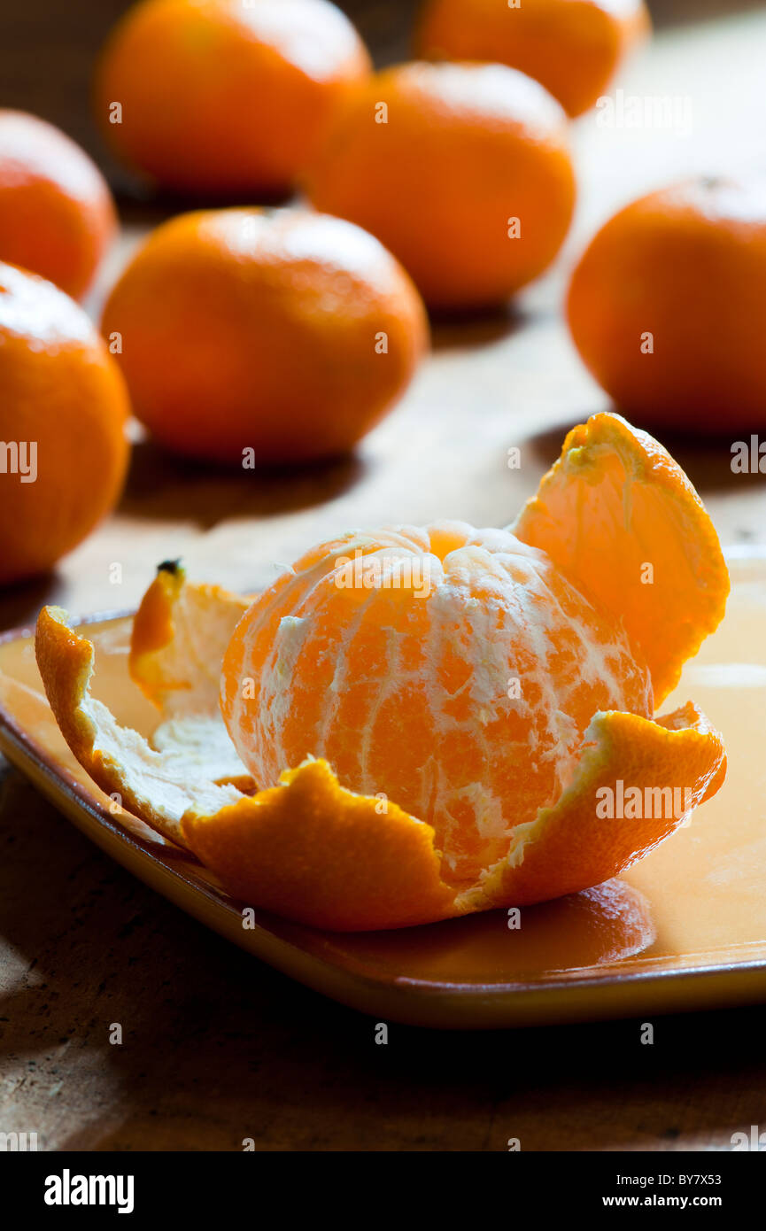 A PEELED CLEMENTINE Stock Photo