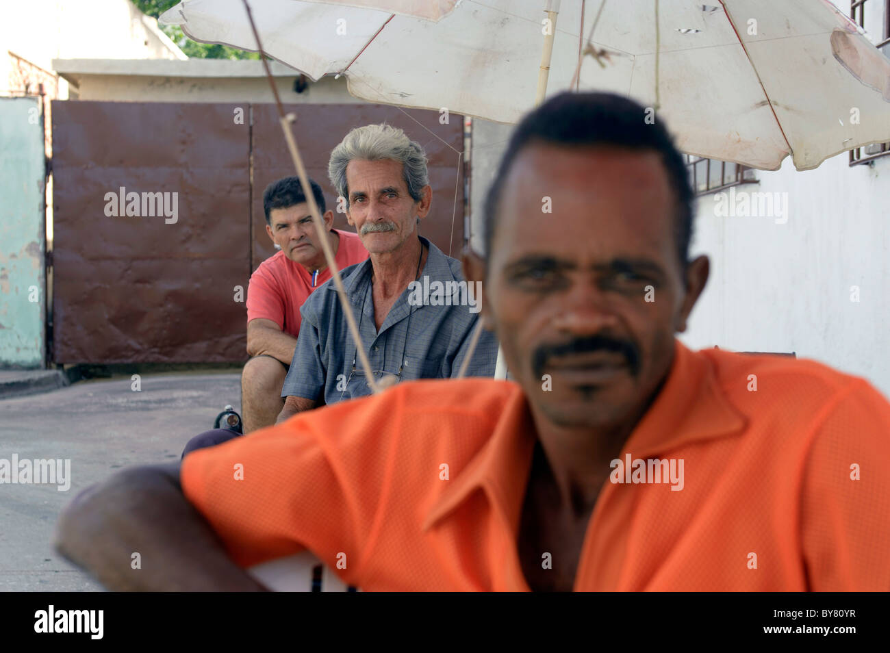 Portrait of cuban bicitaxi driver at rest in Holguin Cuba Stock Photo