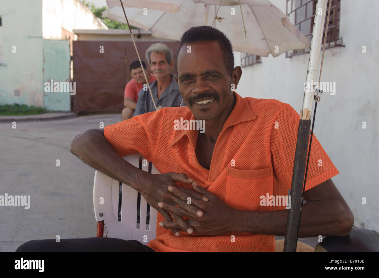 Portrait of cuban bicitaxi driver at rest in Holguin Cuba Stock Photo