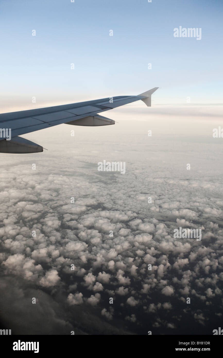 Airplane in white clouds hi-res stock photography and images - Alamy