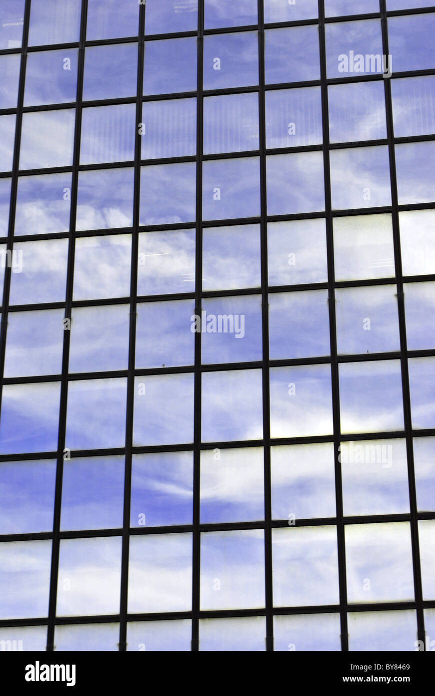 This is a modern glass office building reflecting clouds Stock Photo ...