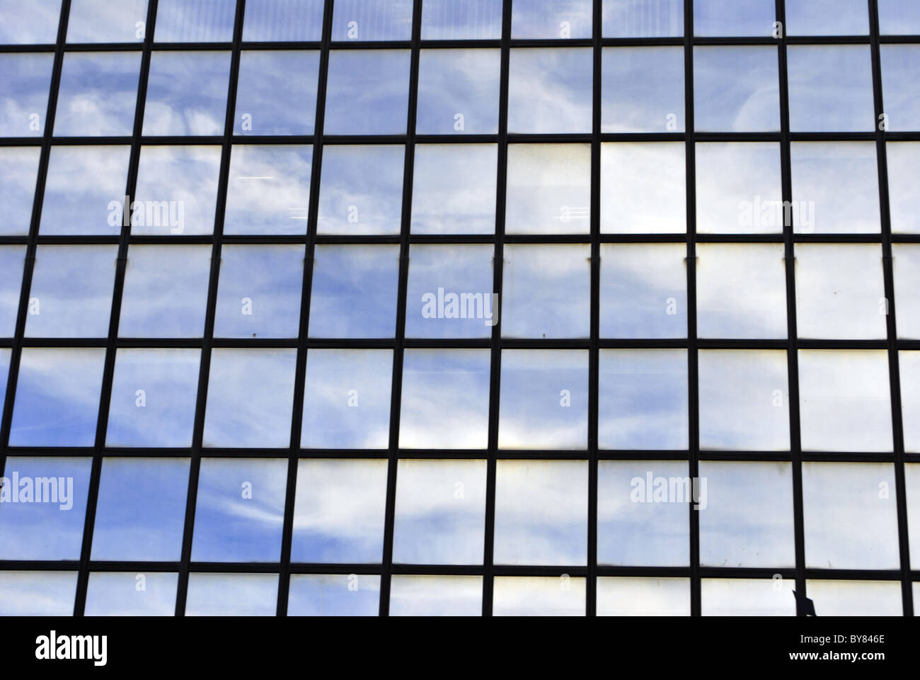 This is a modern glass office building reflecting clouds Stock Photo ...