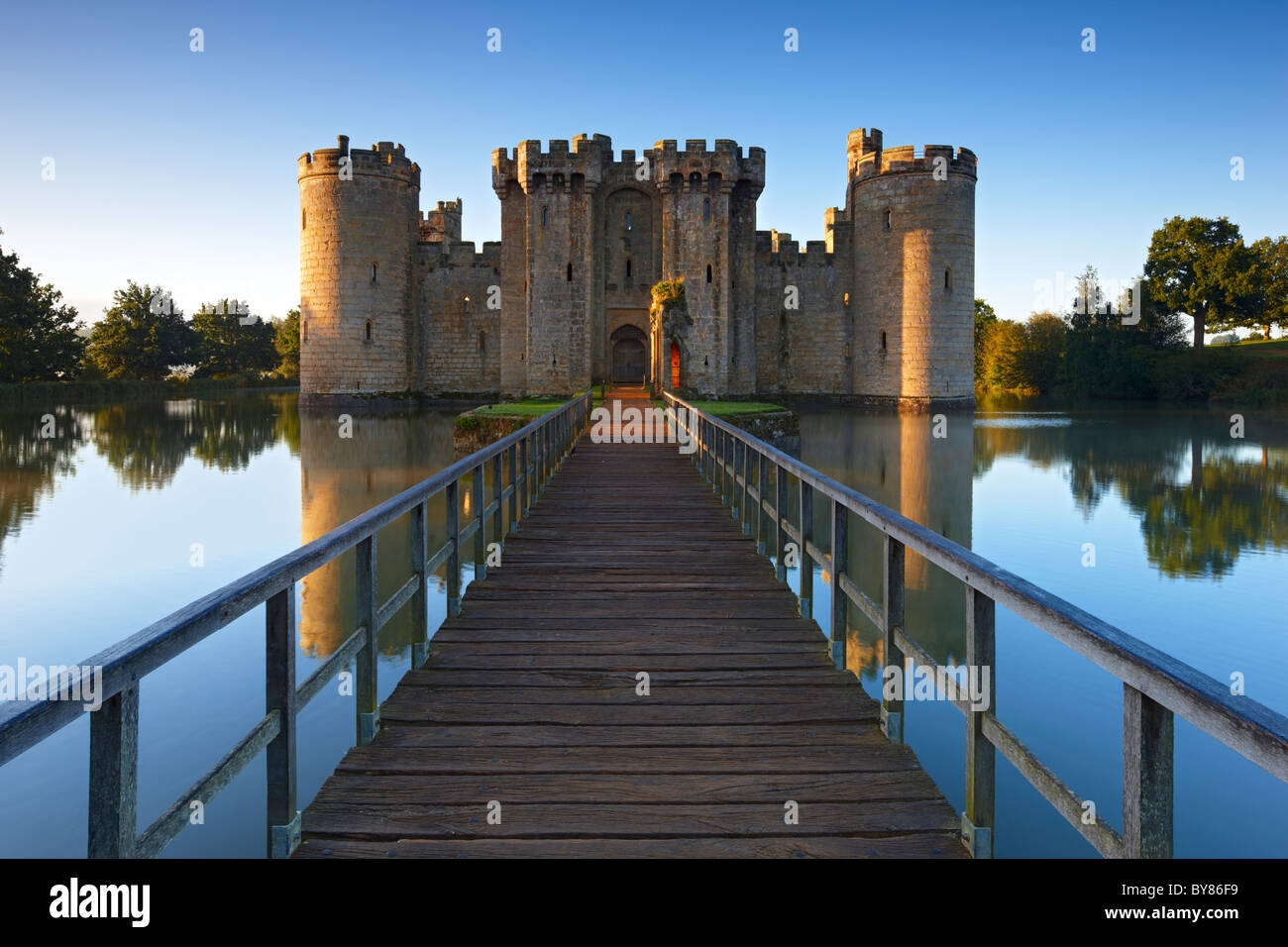 The warm light of dawn shining over Bodium Castle, East Sussex Stock Photo