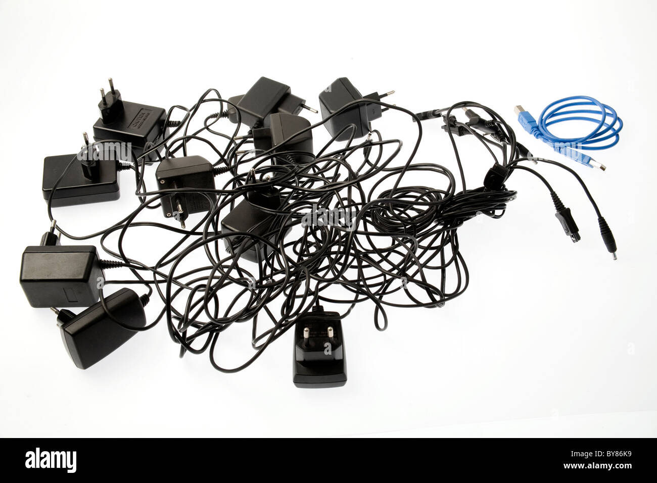 Cell phone chargers and USB cable on white background Stock Photo - Alamy