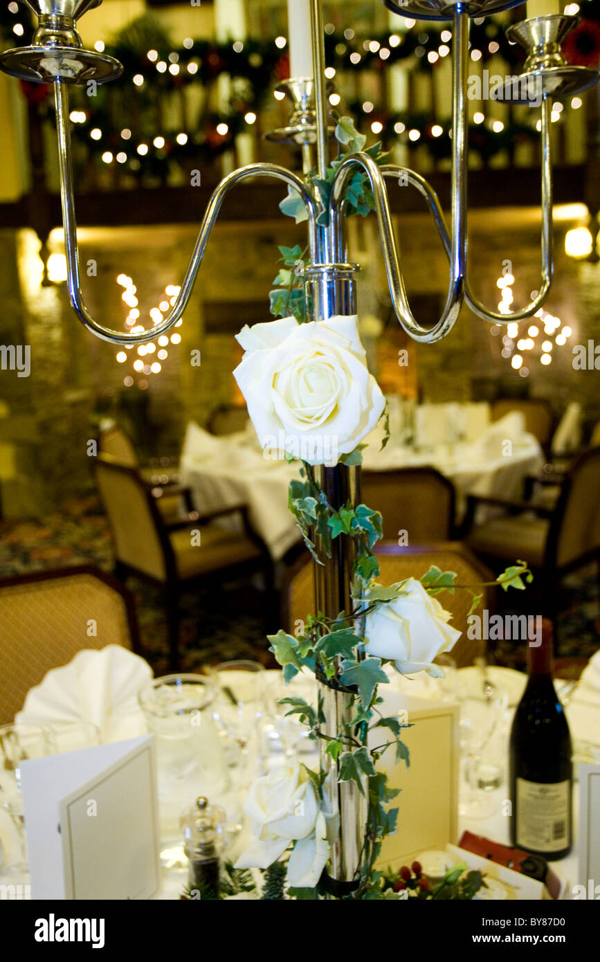 Silver candelabra with white rose Stock Photo Alamy