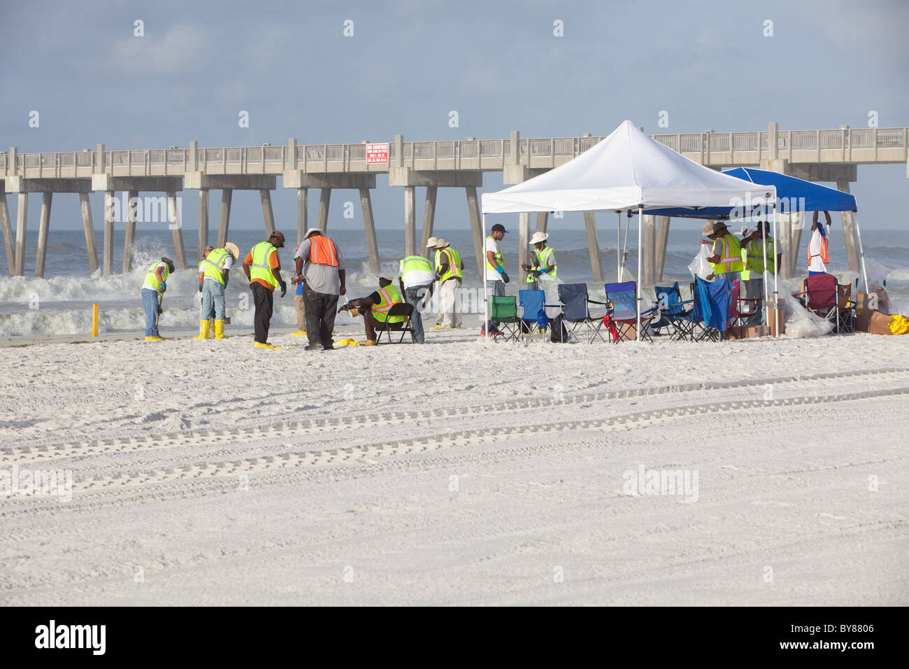 PENSACOLA BEACH JULY 7 oil workers continue to clean the beach of
