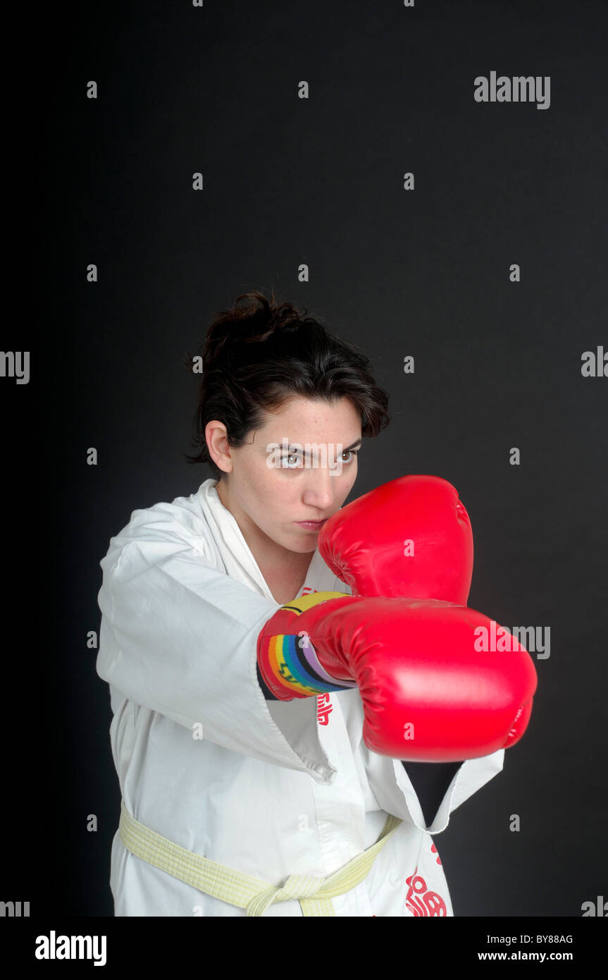 Aggressive female boxer On black Background Stock Photo