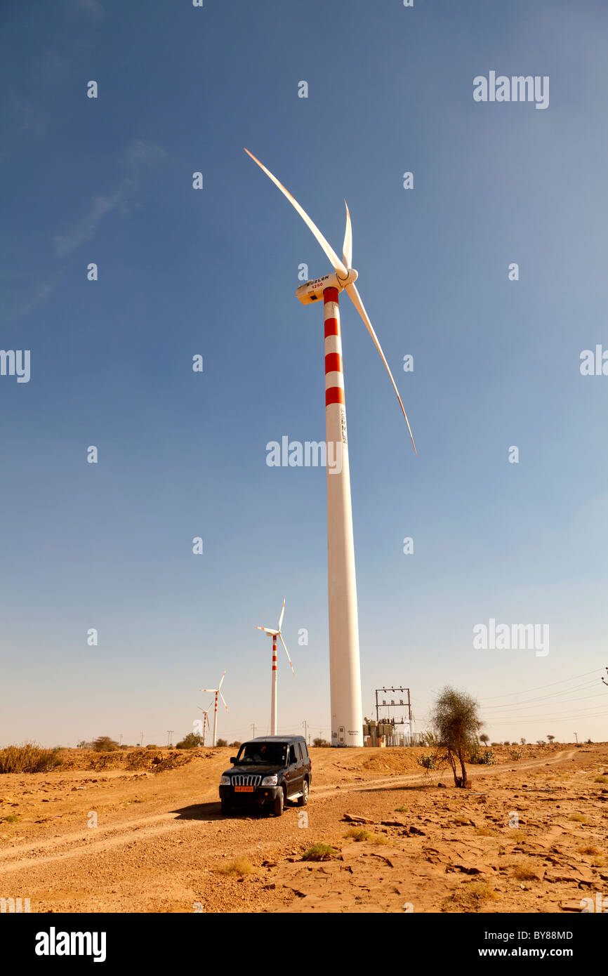 India, Rajasthan, Thar Desert, Wind turbine and engineer's jeep Stock Photo