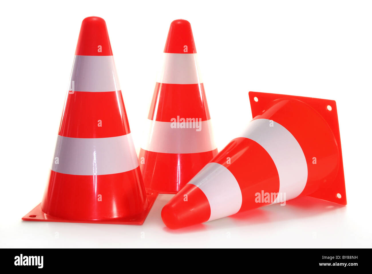 three pylons in front of white background Stock Photo