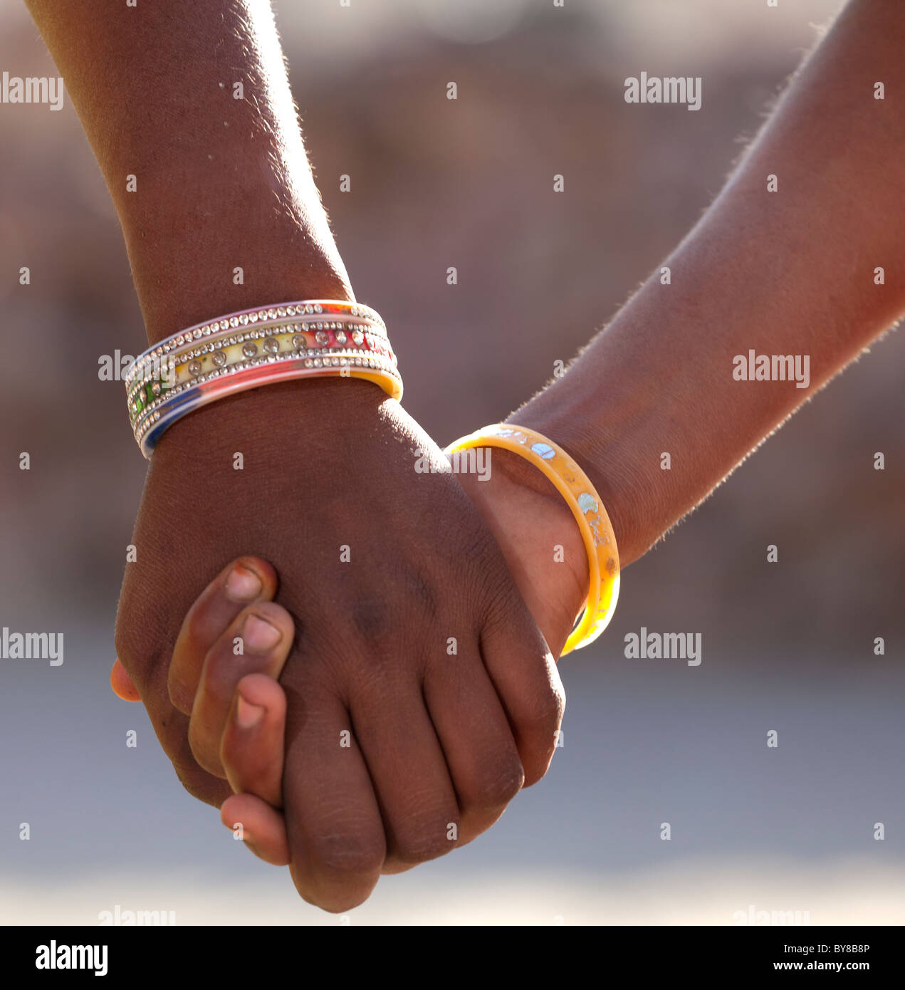 Indian girls holding hands hi-res stock photography and images - Alamy