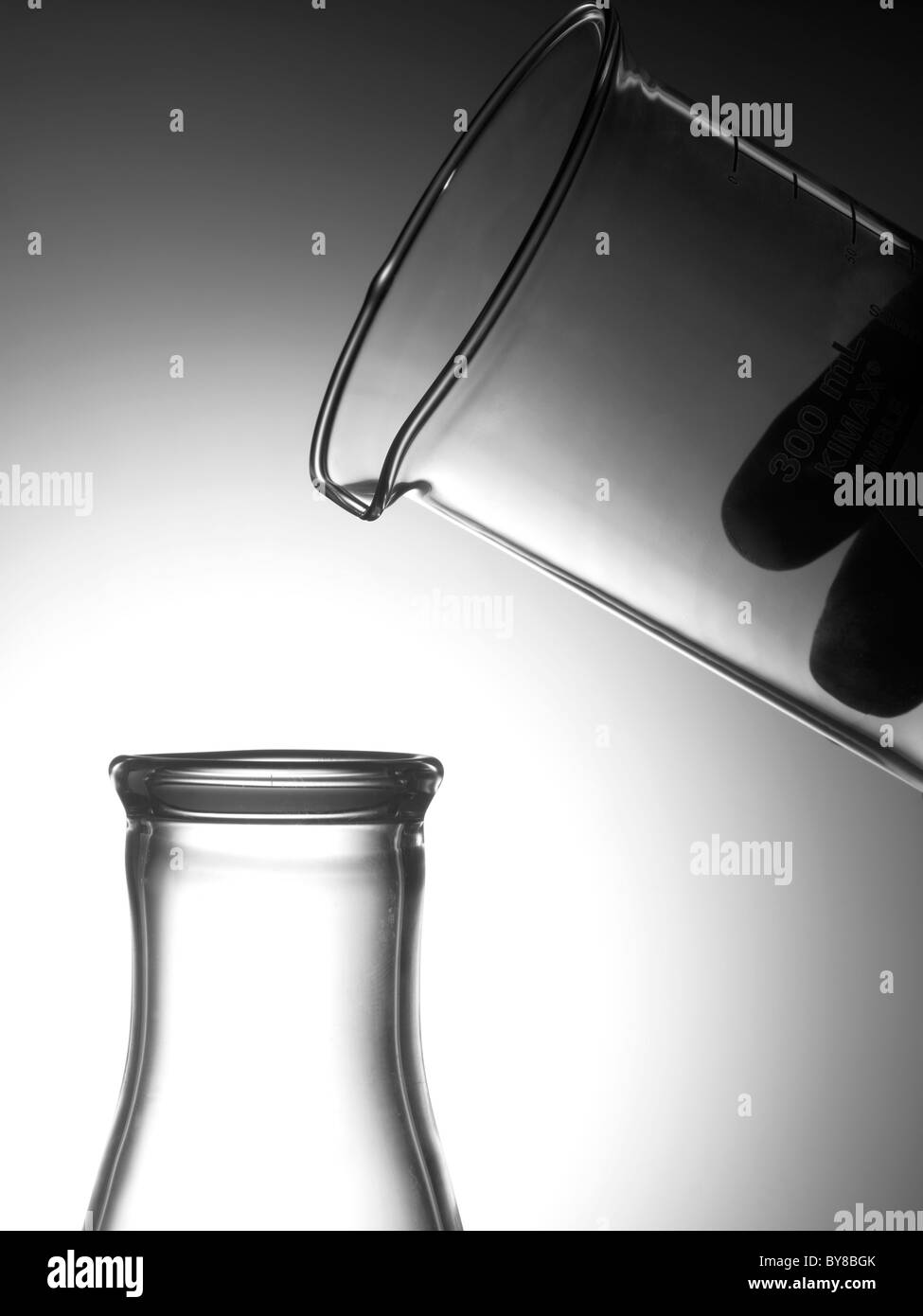 Glass Beakers In Lab With Hand Stock Photo