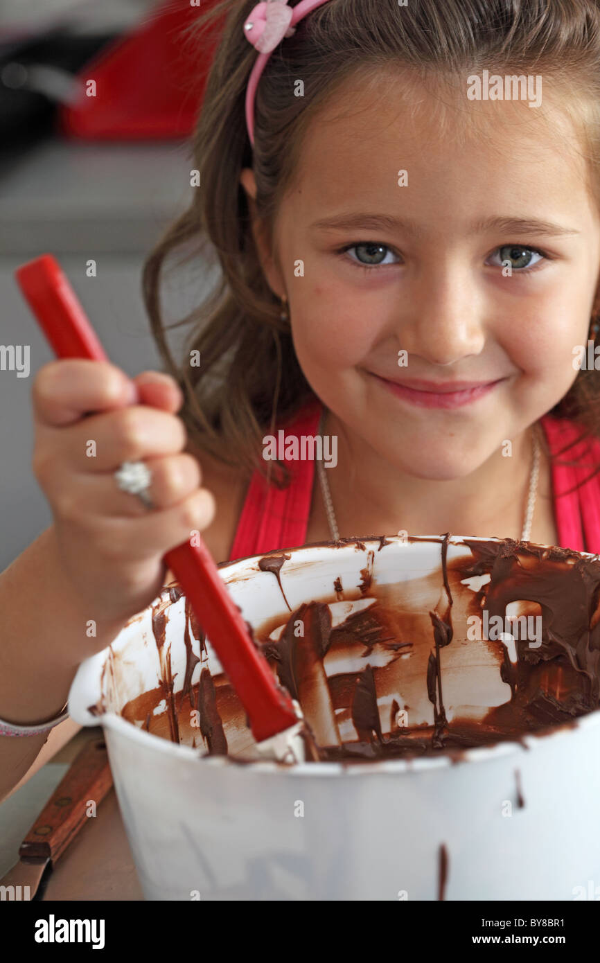 girl cooking chocolate cake Stock Photo Alamy