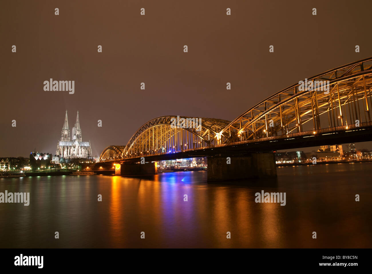 Cologne cathedral with Hohenzollern bridge at night Stock Photo