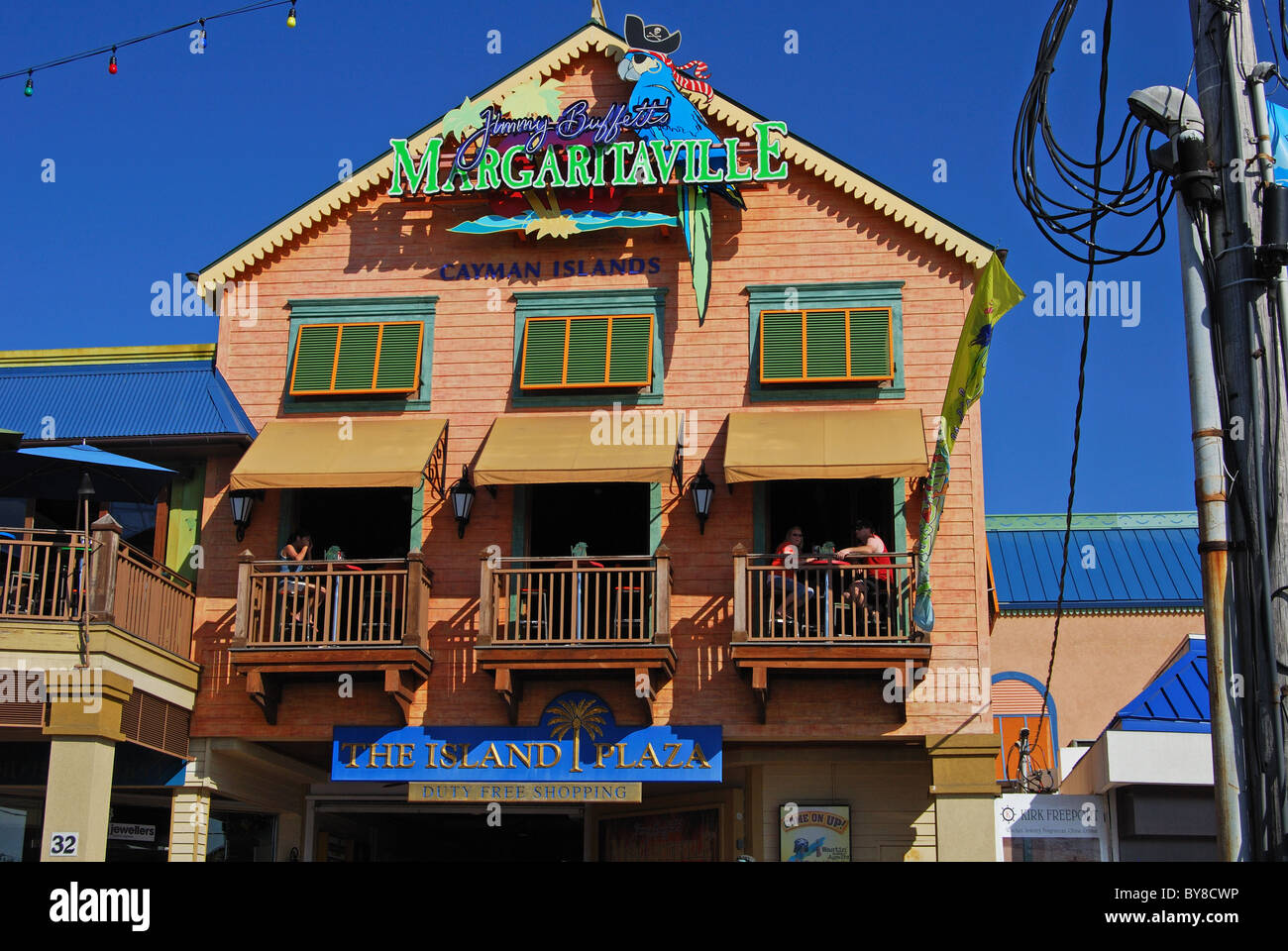 People sitting on restaurant balconies, George Town, Grand Cayman, Cayman Islands, Caribbean. Stock Photo