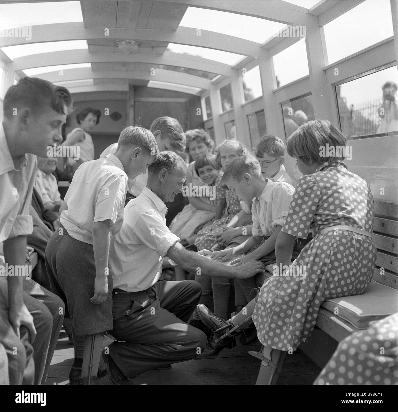 Pupils of Wightwick Special School in Wolverhampton Uk on canal boat trip with some children wearing leg braces 1960 Stock Photo