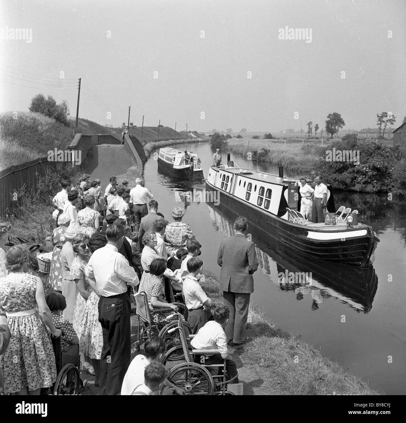 Narrowboats arriving to take pupils of Wightwick Special School in Wolverhampton Uk on canal boat trip 1960 Stock Photo