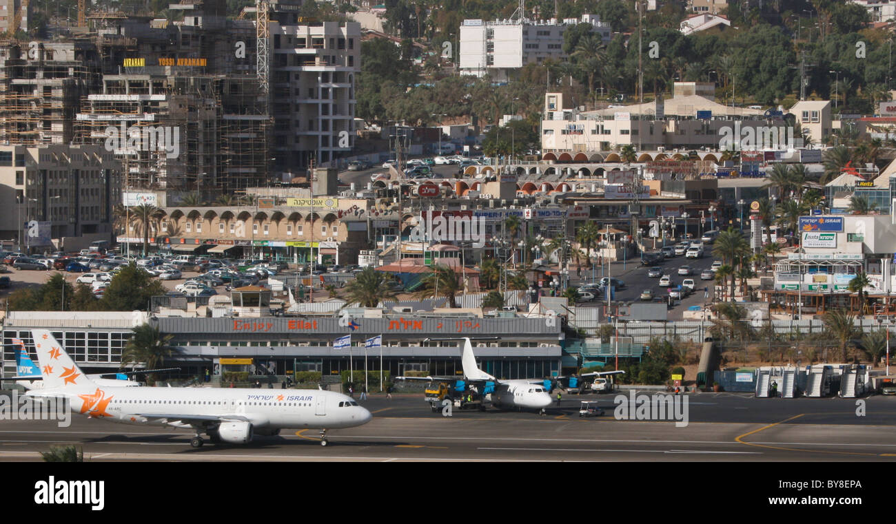 Aircraft at Eilat airport with town in background Stock Photo