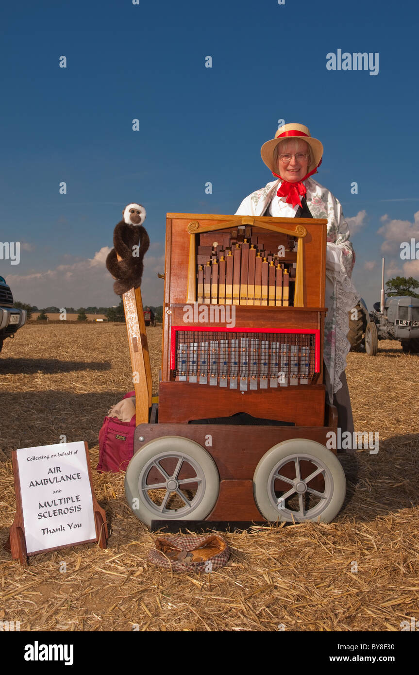 A John Smith busker organ being played to raise money for the air ambulance and multiple sclerosis in the uk Stock Photo