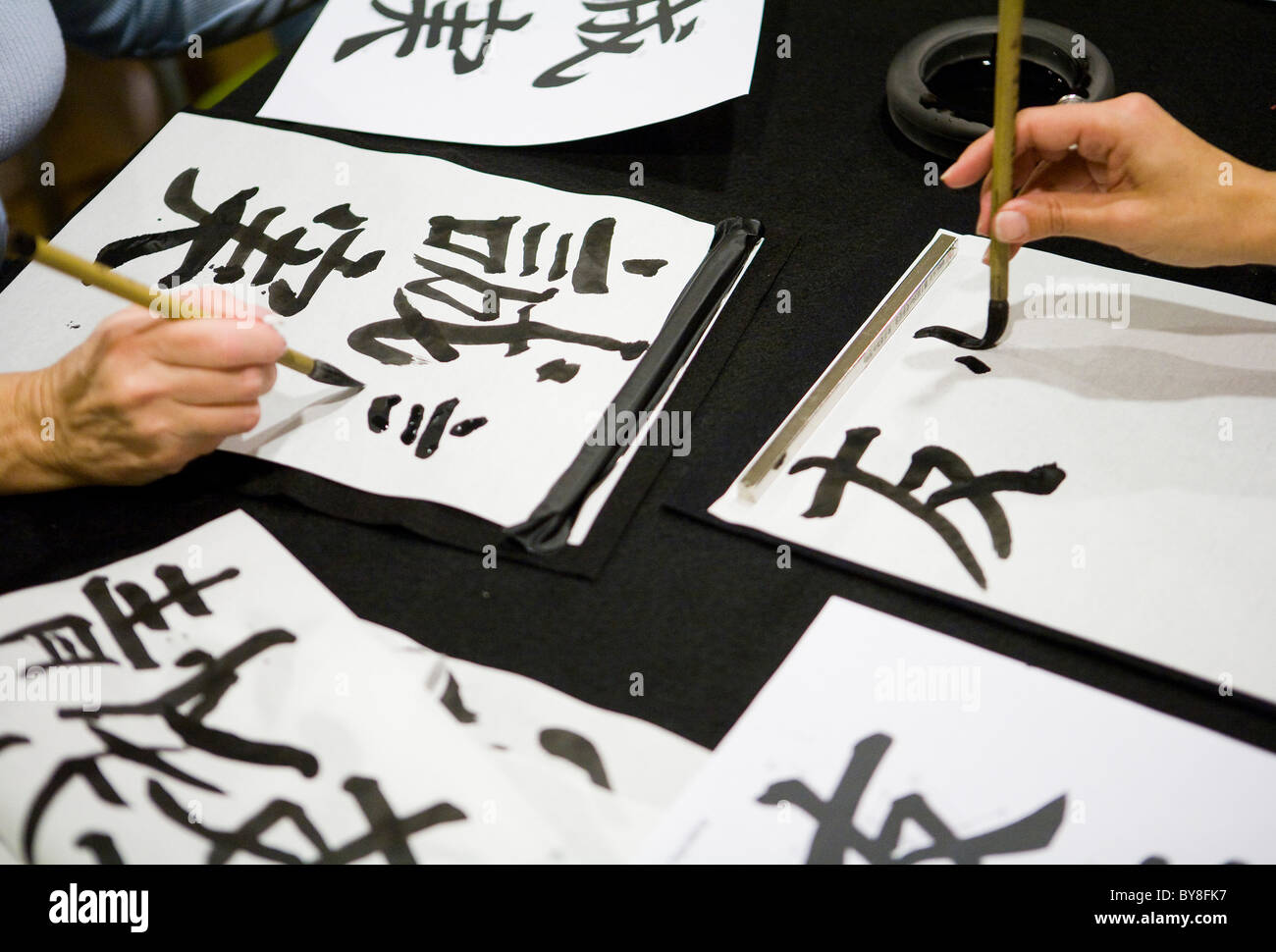 Students in a calligraphy class.  Stock Photo