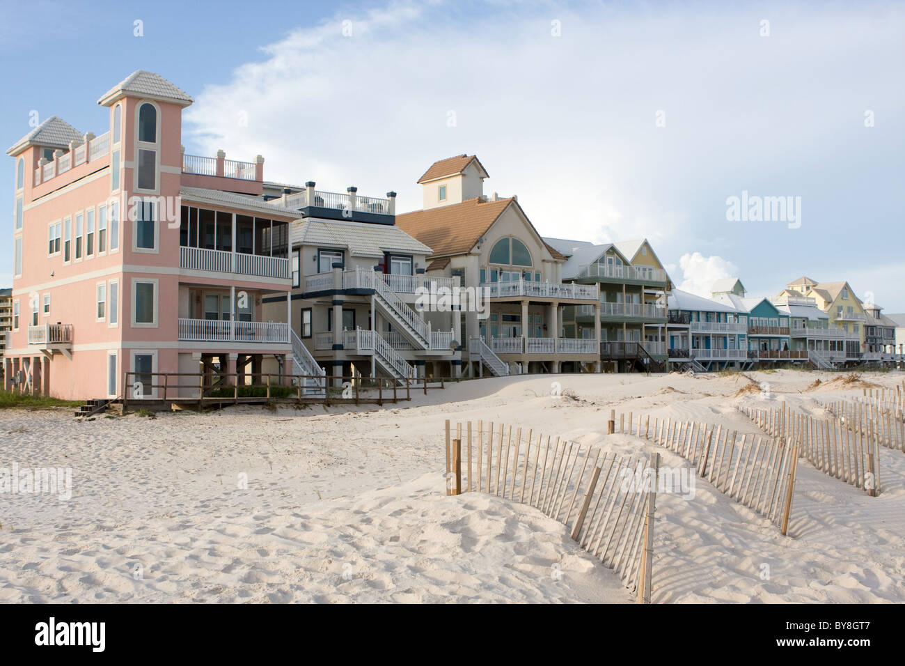 A row of luxury beach homes line the dunes along the Gulf Shores, Alabama coastline. Stock Photo