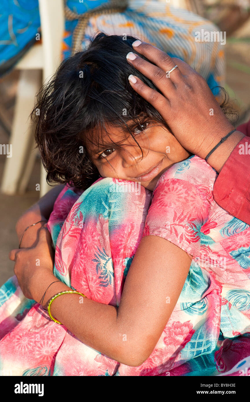 Indian mother nitpicking young girls head in a rural indian village. Andhra Pradesh, India Stock Photo