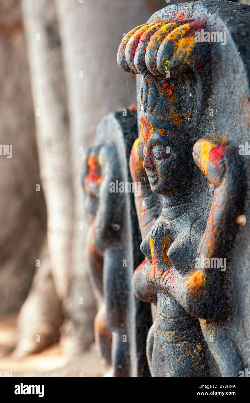 Hindu altar stones at a village temple depicting Indian vishnu deity in ...