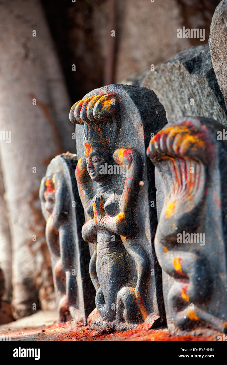 Hindu altar stones at a village temple depicting Indian vishnu deity in ...