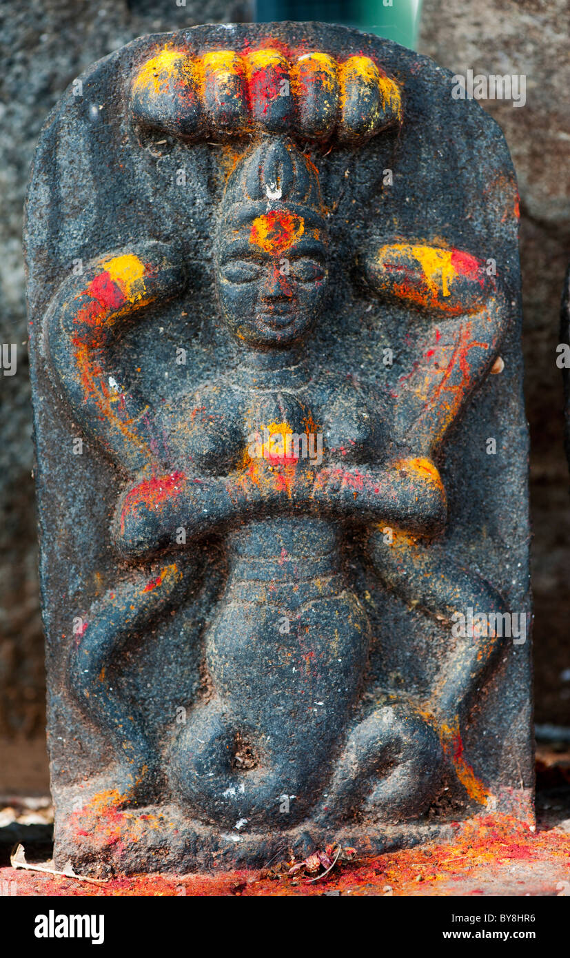 Hindu altar stones at a village temple depicting Indian vishnu deity in ...