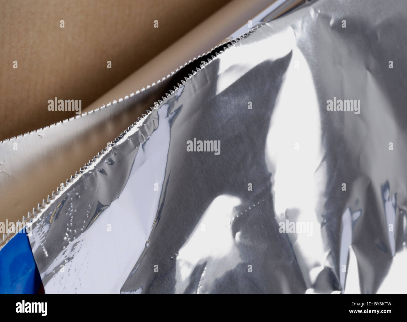 Tin Foil with Serrated Edge Cutter Stock Photo Alamy