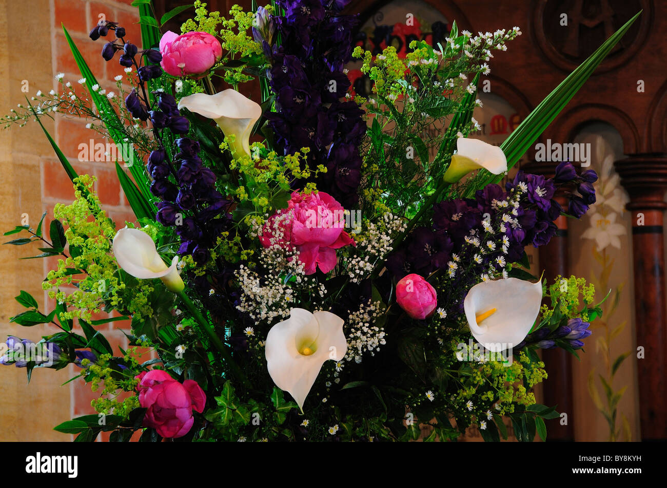 Flower arrangement in church for country wedding. Dorset, UK June 2009