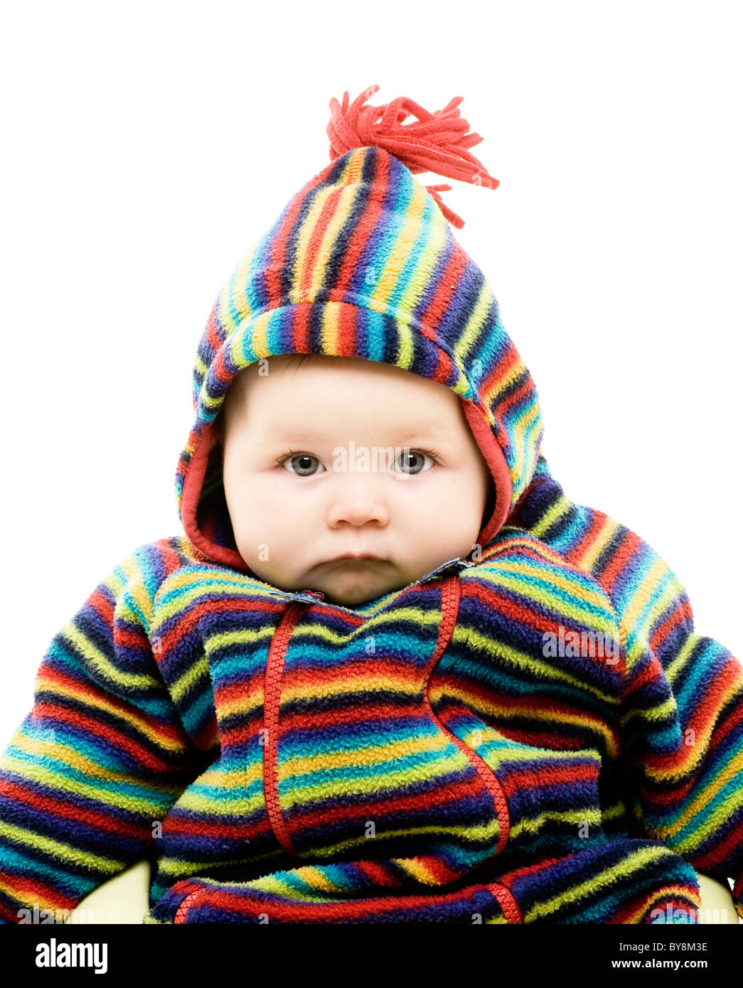 Baby in brightly coloured outfit Stock Photo