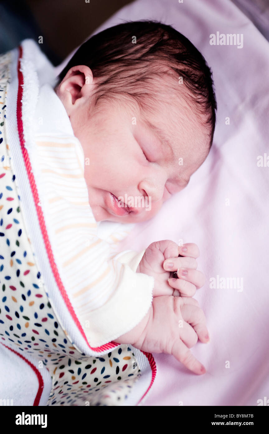 Newborn Baby In Hospital One Day Old Sleeping In His Crib Stock