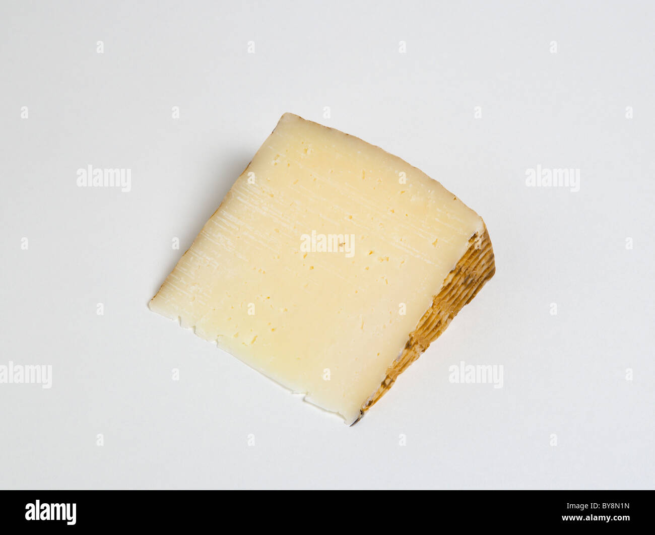 Food Dairy Produce Cheeses Slice of Spanish Manchego cheese made from