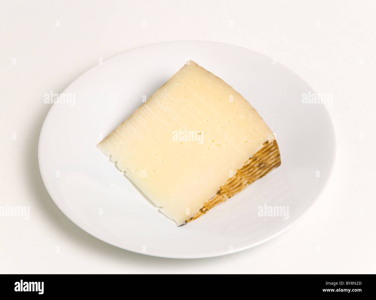 Food Dairy Produce Cheeses Slice of Spanish Manchego cheese made from
