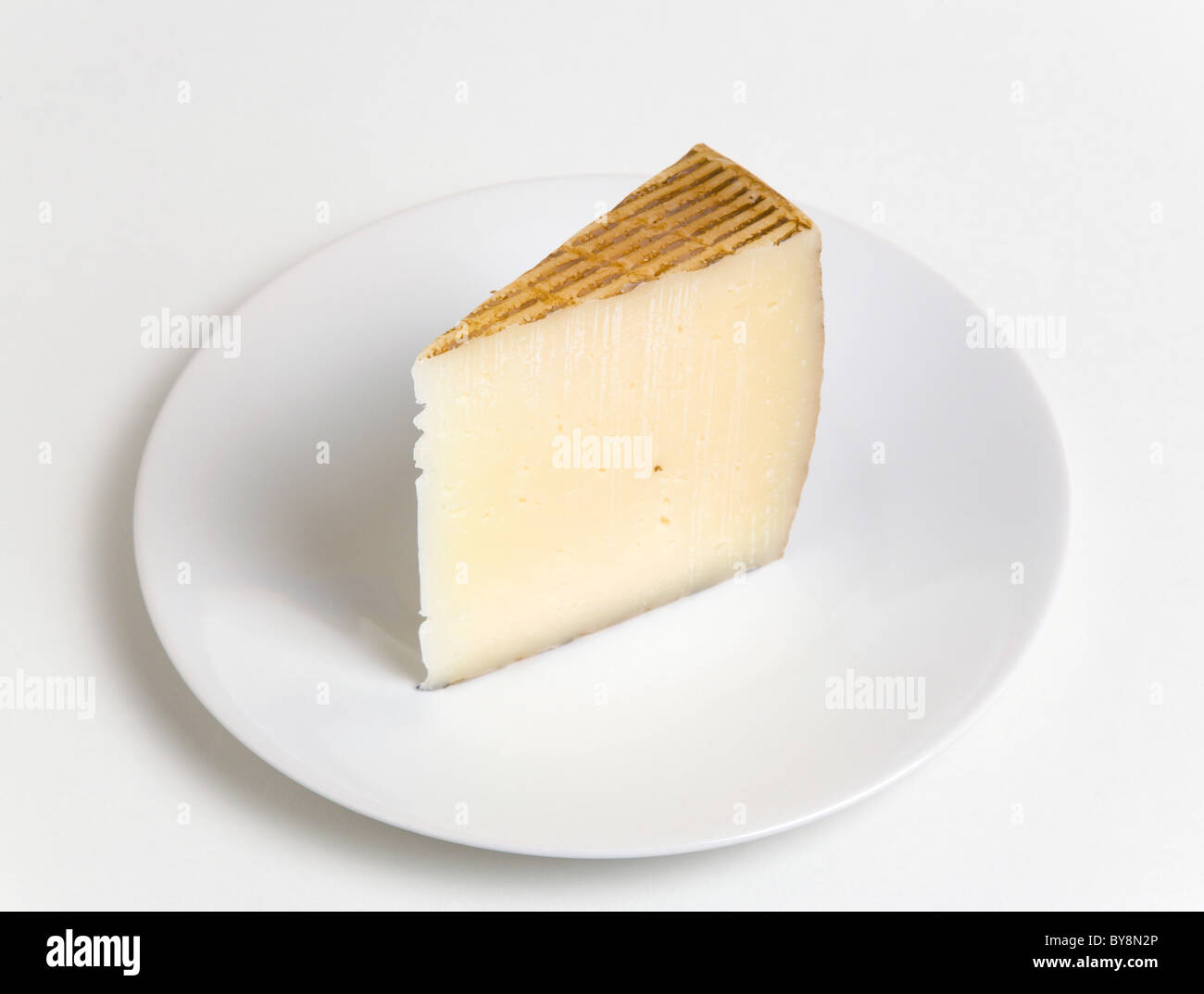 Food Dairy Produce Cheeses Slice of Spanish Manchego cheese made from