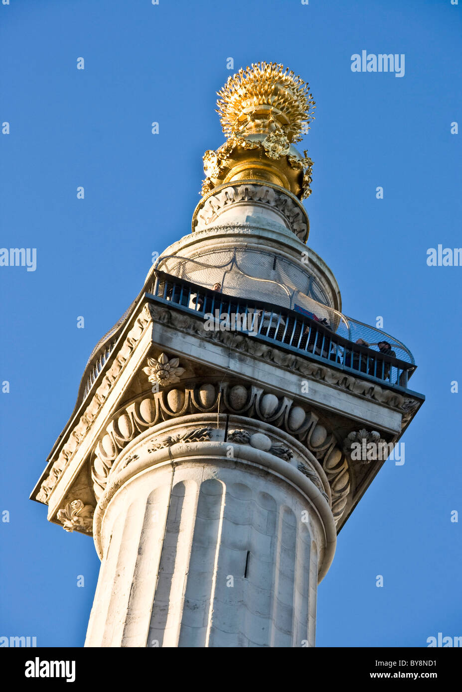 Tourists on viewing platform and copper urn Great Fire of London Monument London England Europe Stock Photo