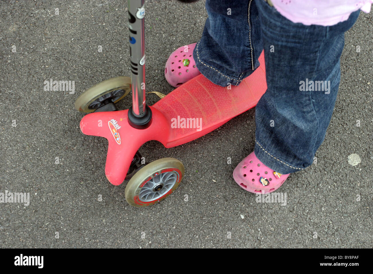 Young Girl with Micro Scooter Stock Photo