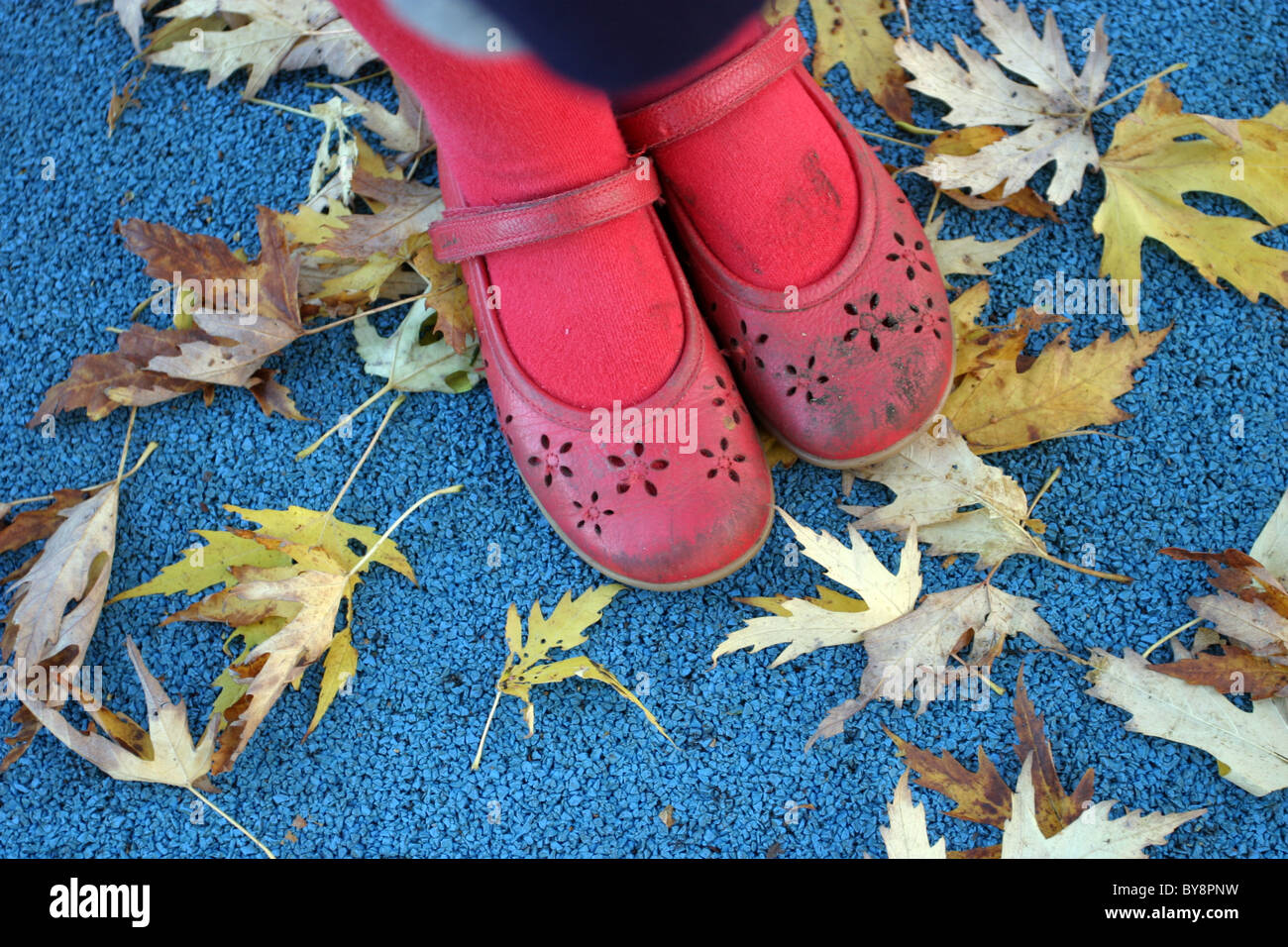 Young Girl Wearing Red Shoes Stock Photo