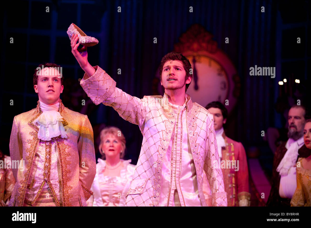 Prince Charming holding the glass slipper in 'Cinderella' the traditional pantomime, Aberystwyth Arts Centre, UK Stock Photo