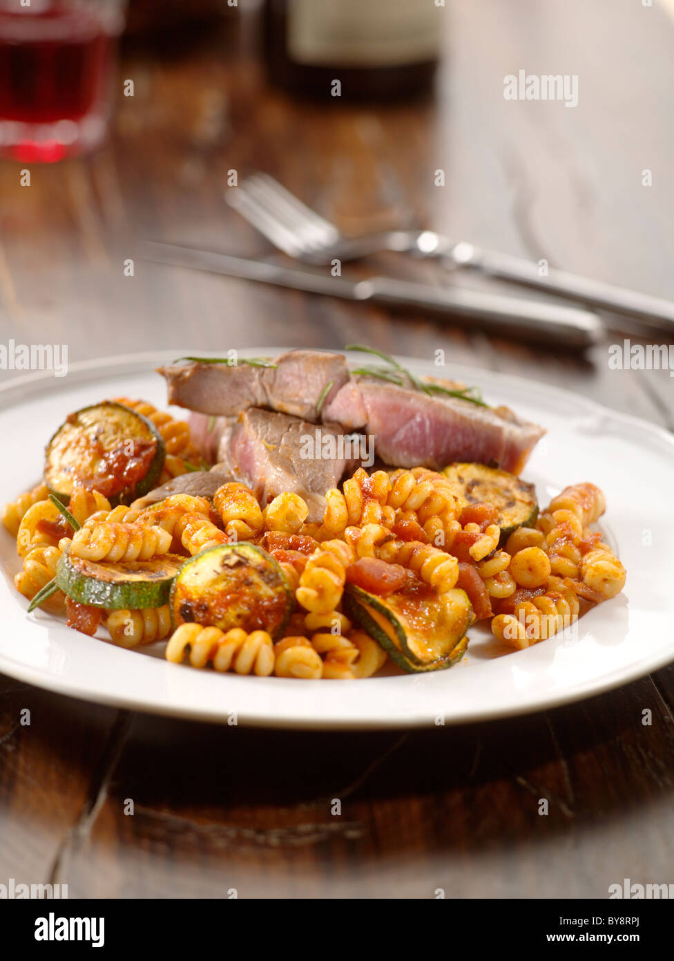 Barbeque steak with pasta Stock Photo