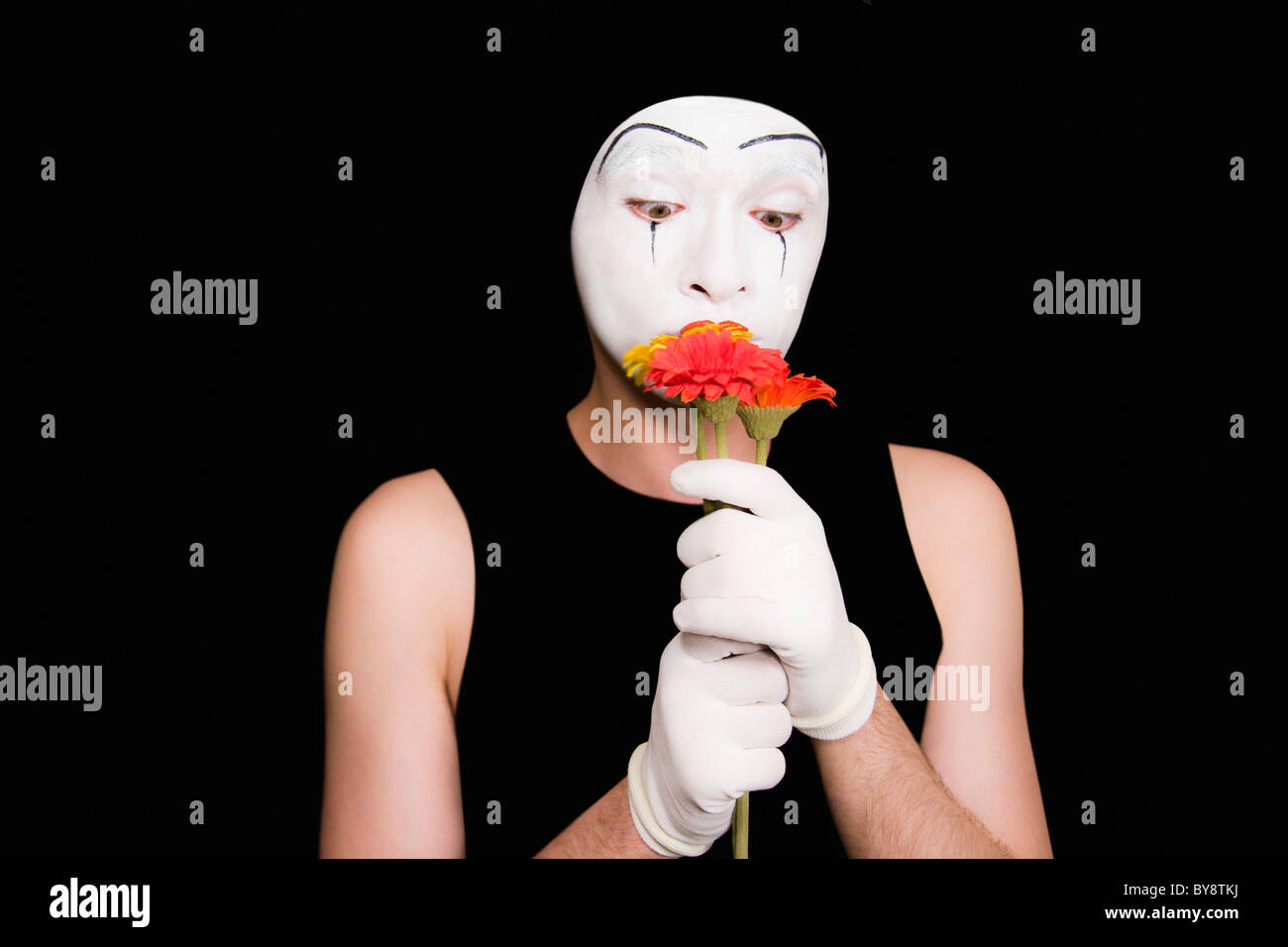 Portrait of mime in white gloves With flowers Stock Photo Alamy