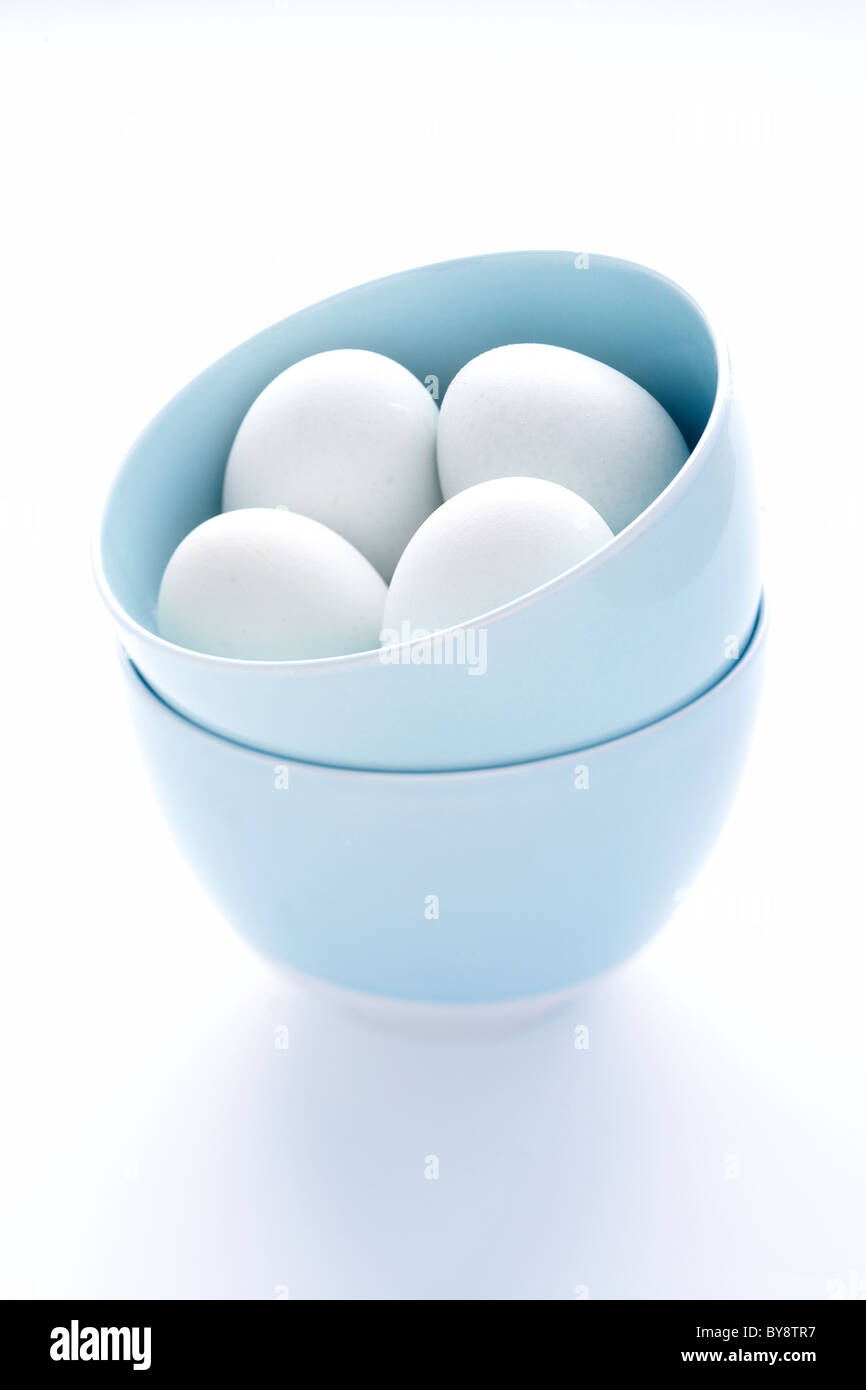 Egg on blue background Stock Photo