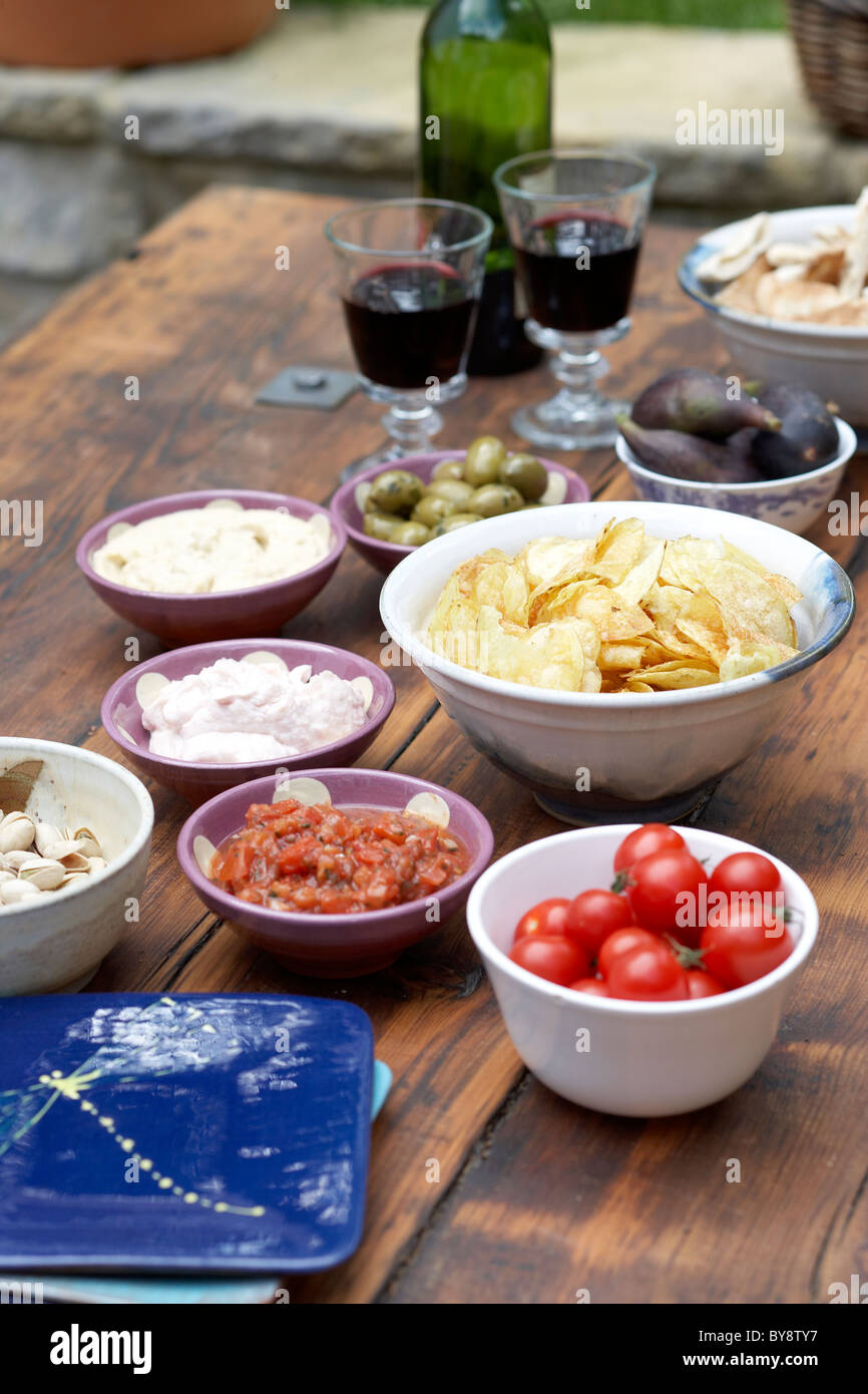 Dips with crisps and red wine Stock Photo