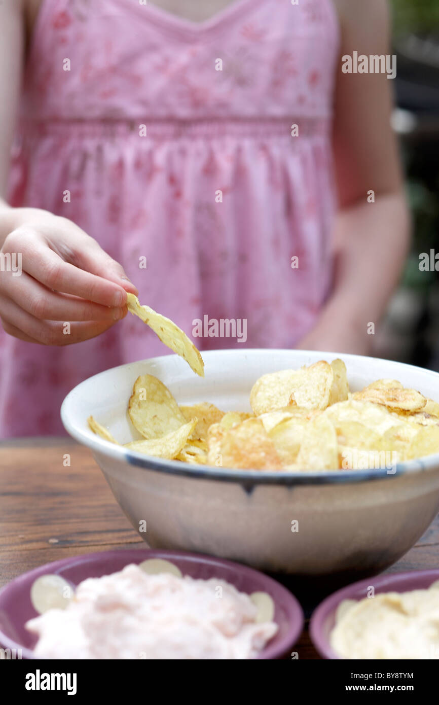 Child eating crisps Stock Photo